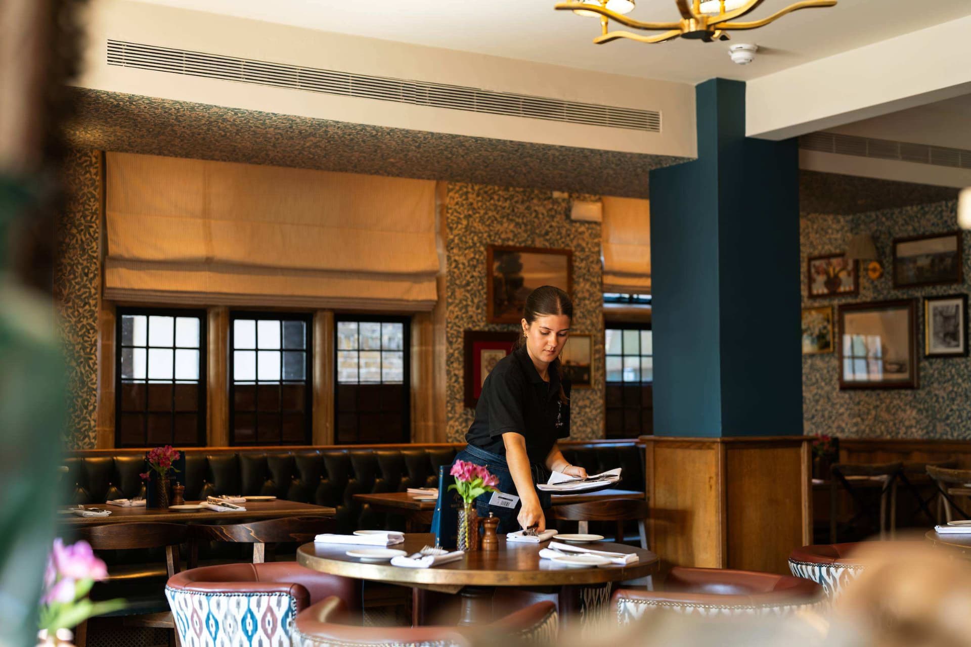 Team member setting table for dining